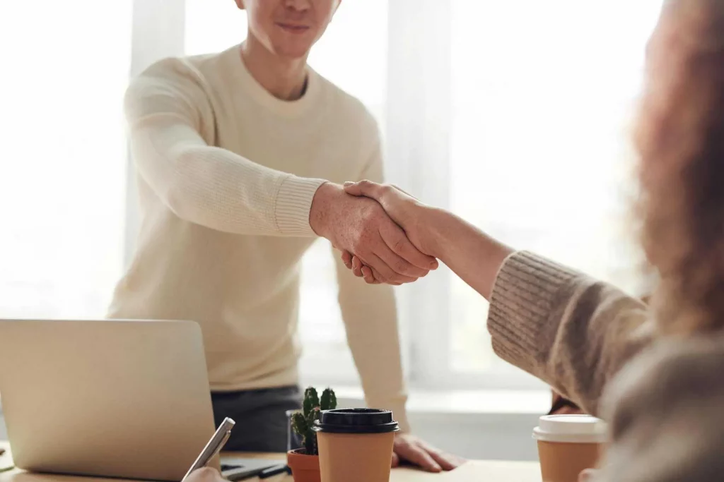 Expats networking in Berlin, job interview in a modern office, coworking space in Berlin, successful expat professionals in Germany